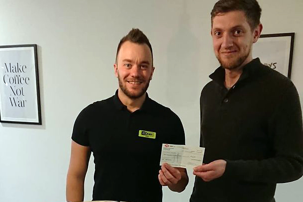Lewis Morris hands cheque to Craig Field